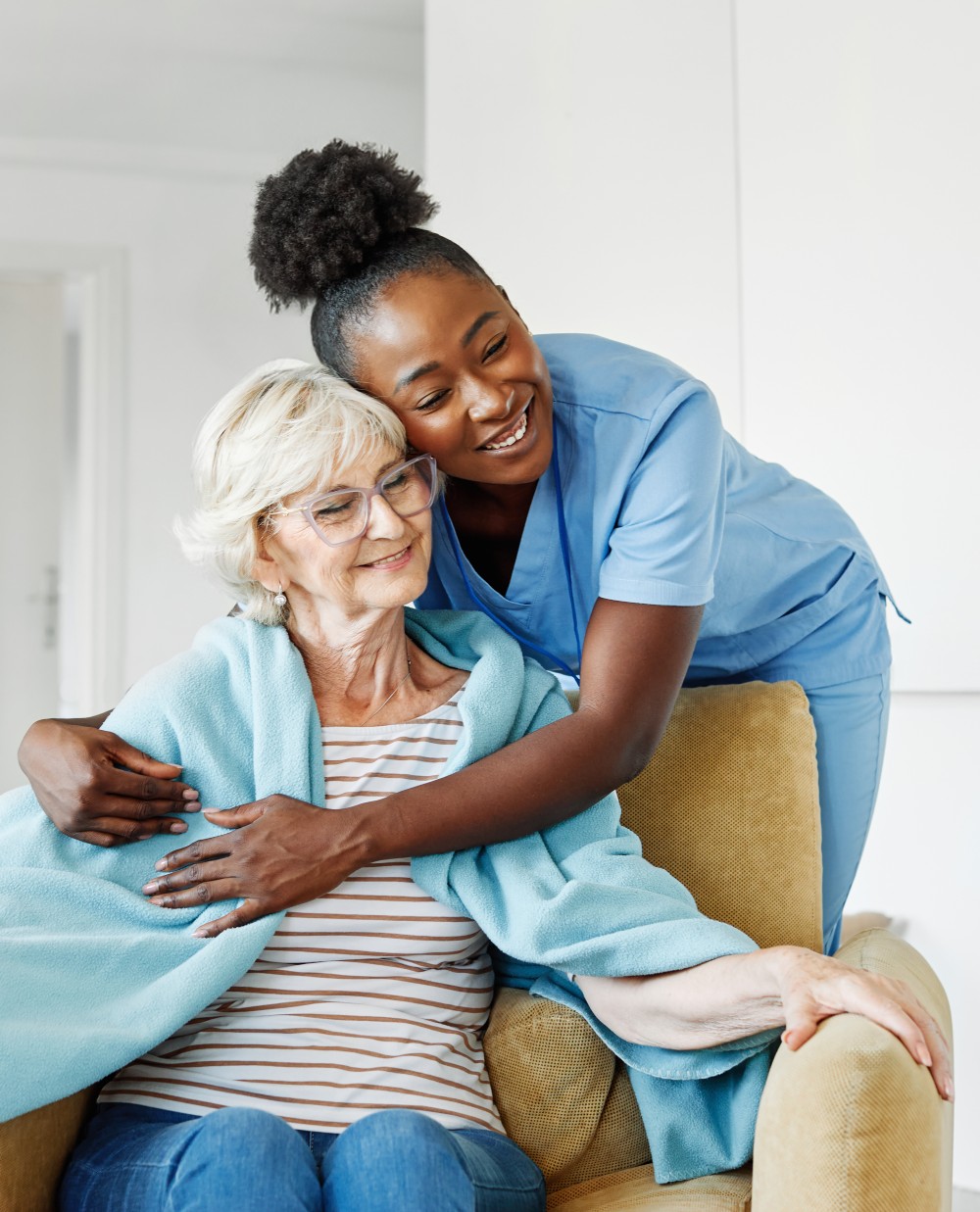 Caregivers assisting seniors with daily tasks and activities in a supportive environment